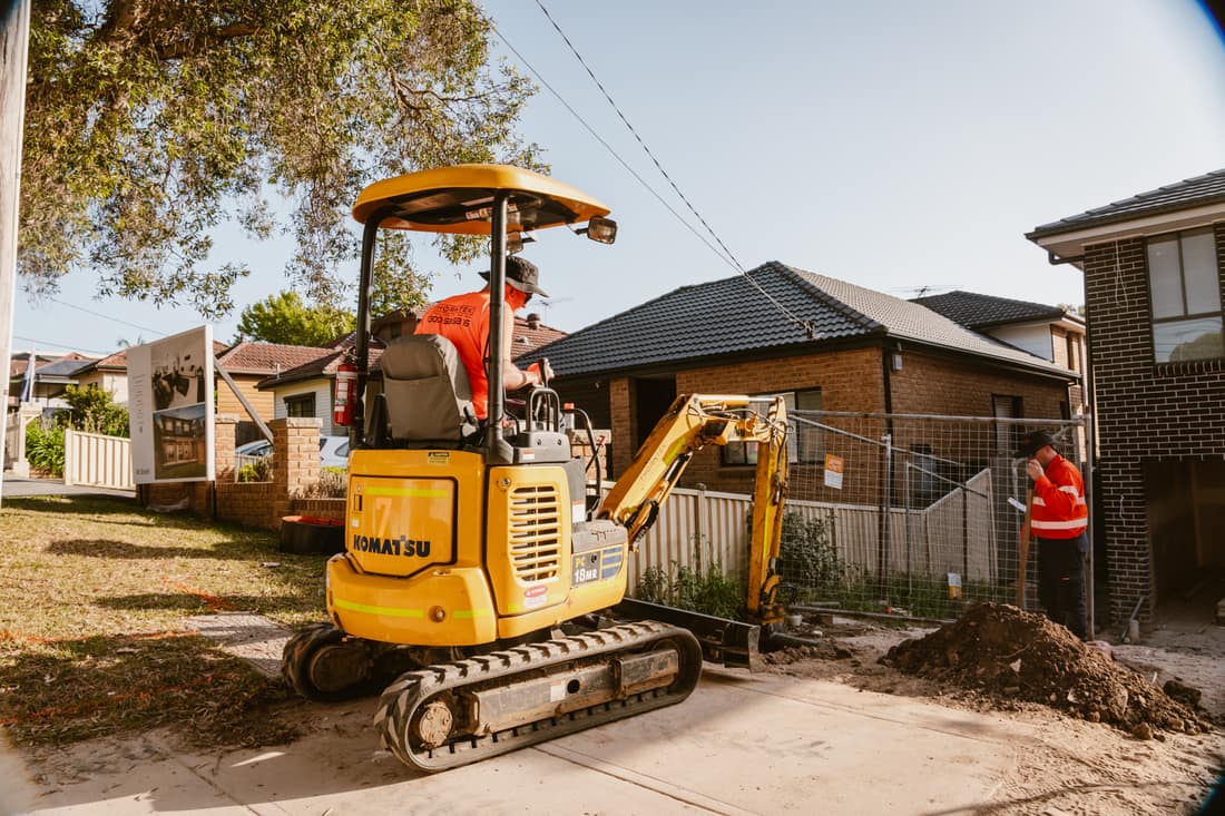 Thorntek excavator trenching on a residential job