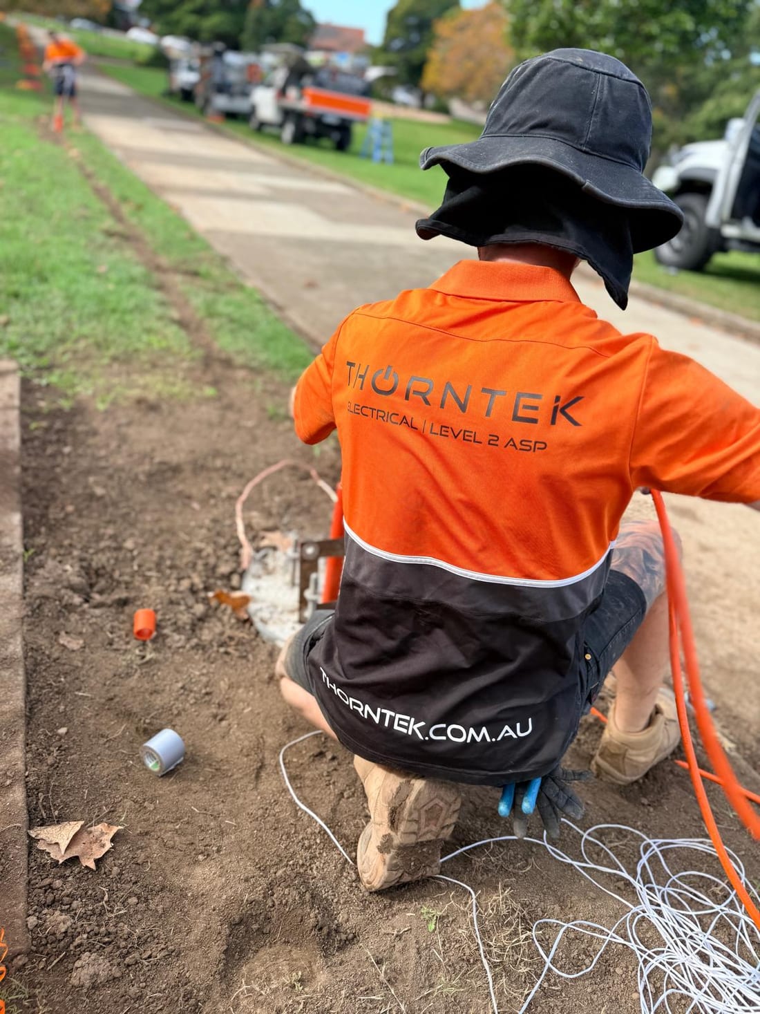 Thorntek electrician pulling cable into a pit at Yeo Park, Ashfield