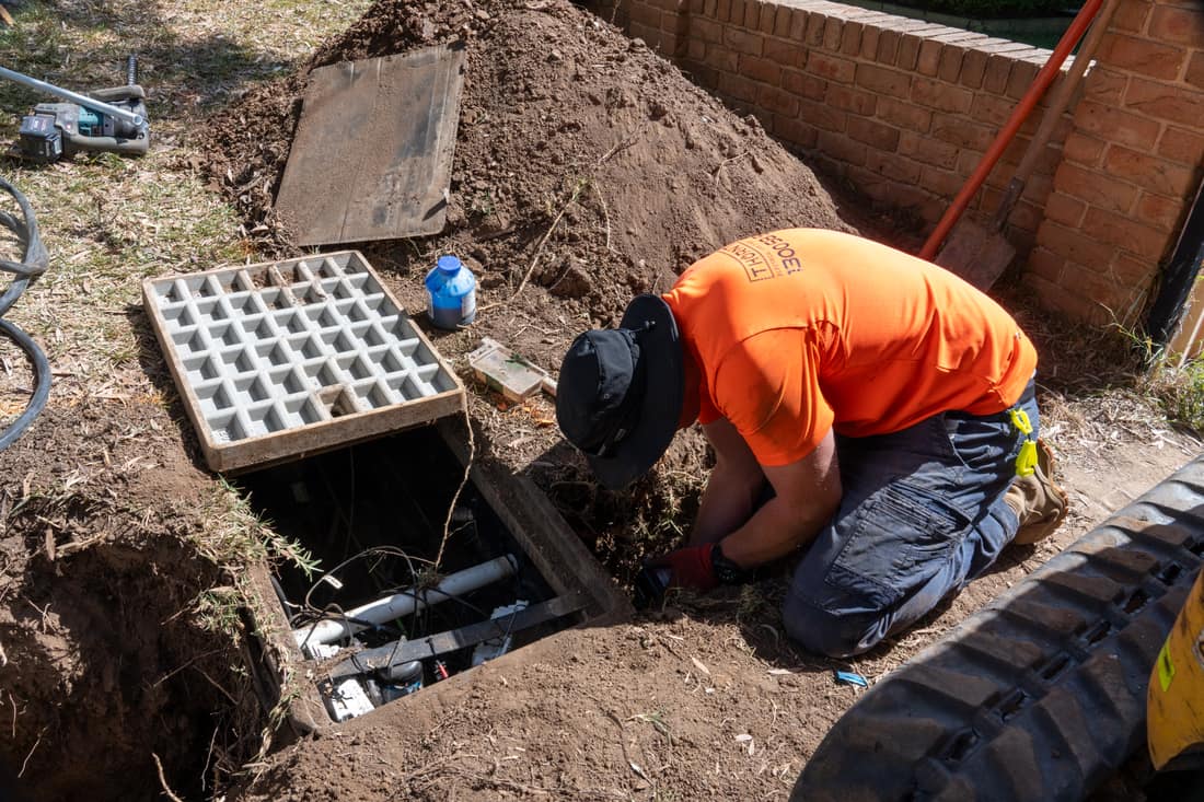 Thorntek electrician at an open underground service pit